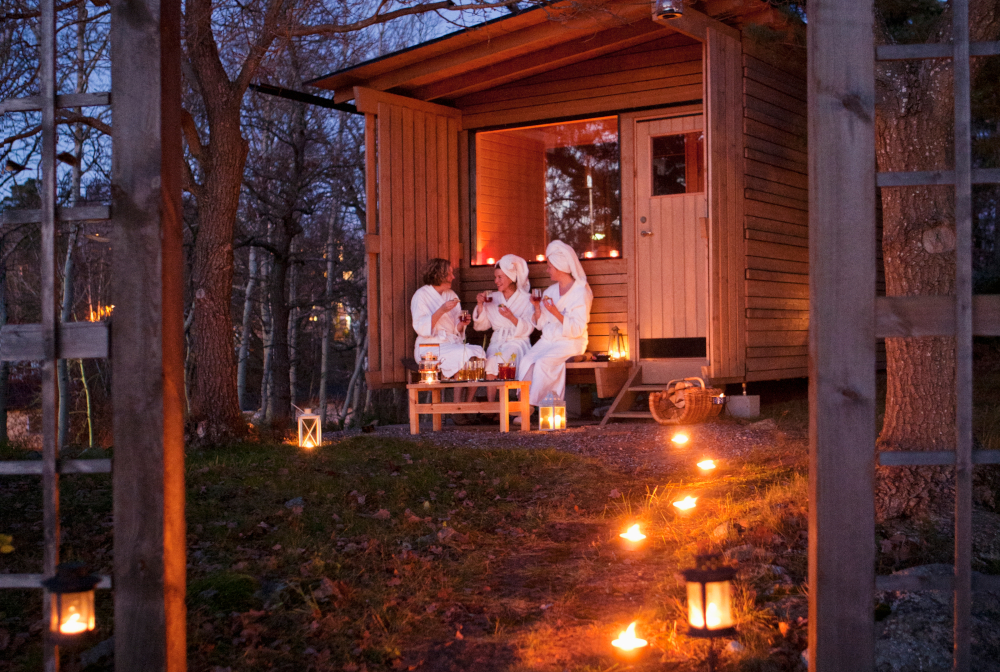 Sweden, Stockholm, Nacka, Terrassvagen 1, Women Sitting Outside Sauna